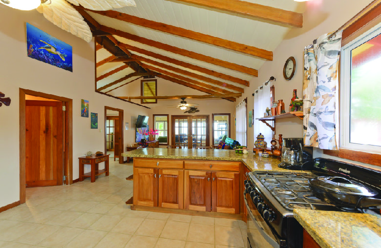 Spacious Granite Counter Kitchen with Barstools