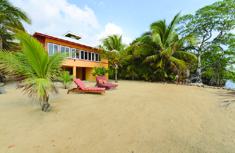 Sandy Beach with Chaise Lounge Chairs